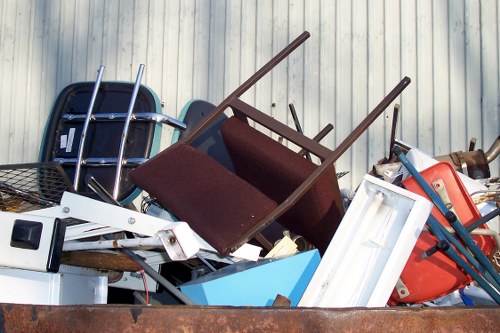 Clearance team sorting items in Gunnersbury home